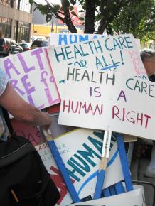 Signs at a Chicago demonstration for single-payer health care