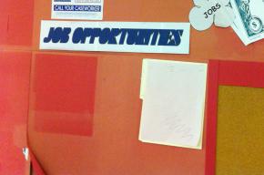 An empty job board in a Chicago public services office