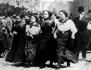 Striking garment workers march against the mill owners in Lawrence